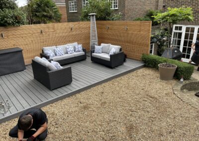Light grey composite decking and timber fence Falkirk