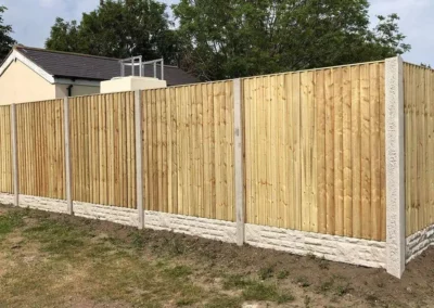 Timber fence and concrete post
