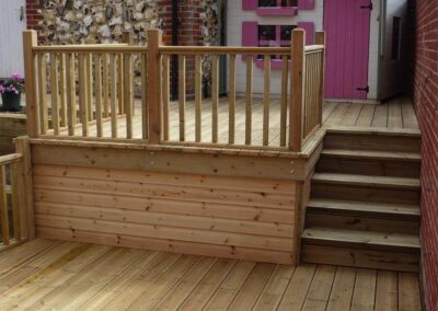 Timber decking installation with steps and handrails