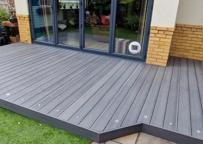 Installation of grey composite decking with lights